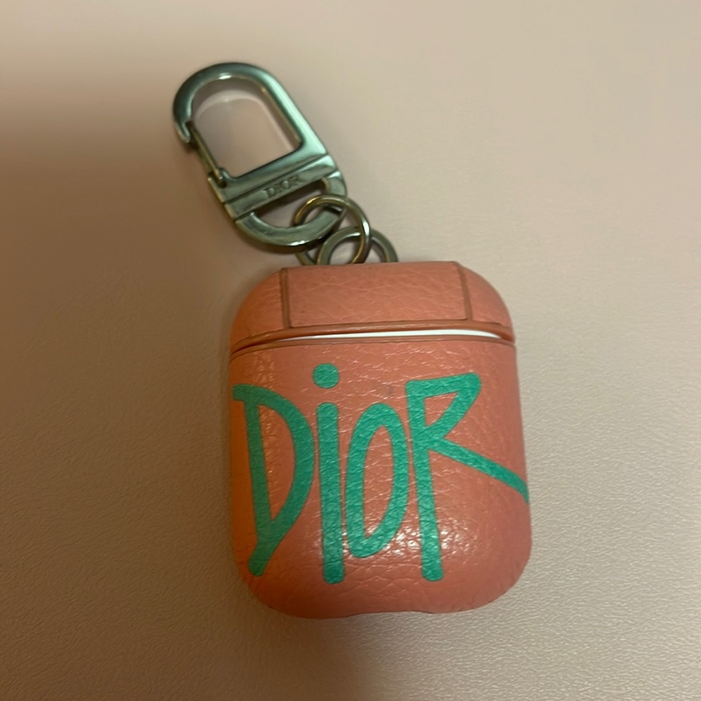 Dior airpod case keychain.
